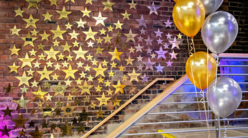Theatre Royal Wakefield's wall of fame, hundreds of gold metal stars on a brick wall