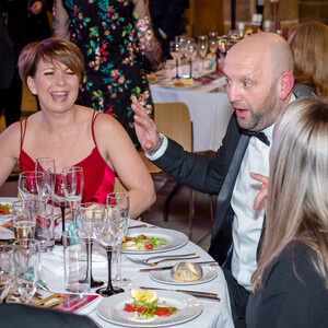 Picture of some Gala Dinner Guests talking and laughing.
